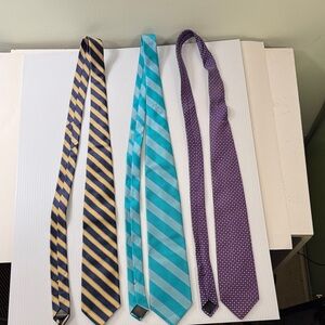 Brooks Brothers ties, 3 of them. Navy Blue and gold, teal and green, purple.
